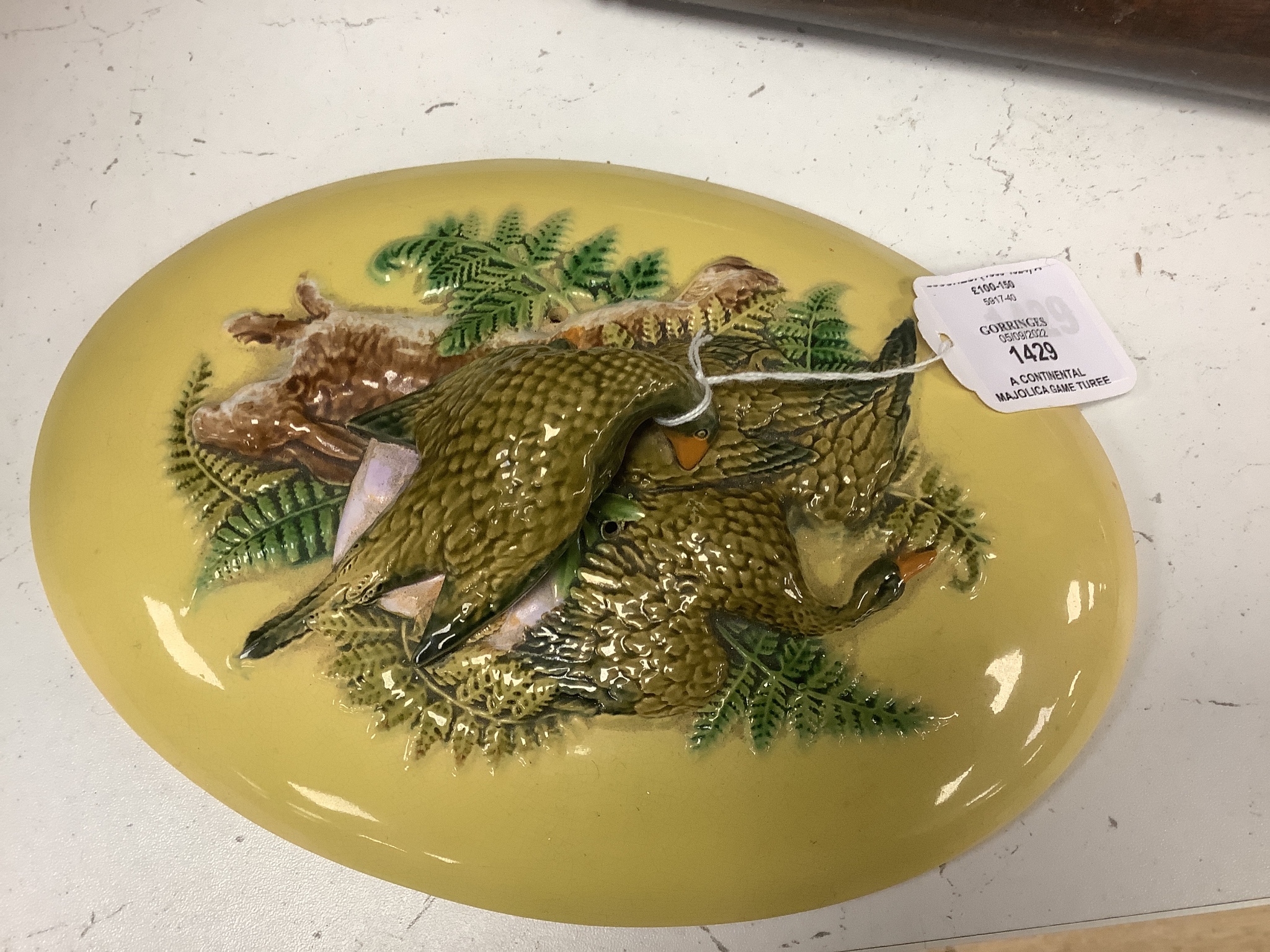 A Continental majolica game tureen with floral and bird relief, 18cm tall